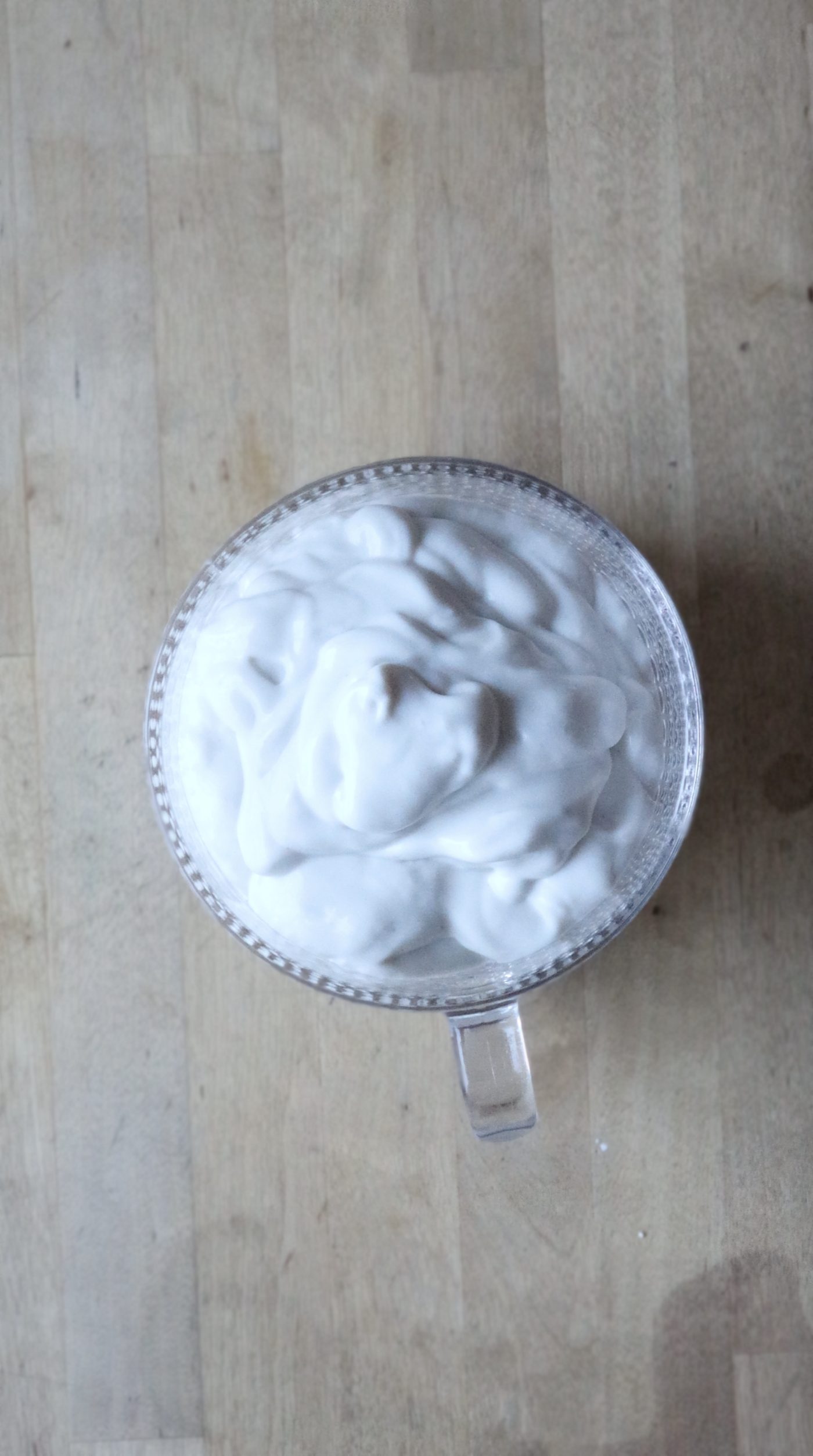 Yogurt layered in a glass mug for chia seed parfait