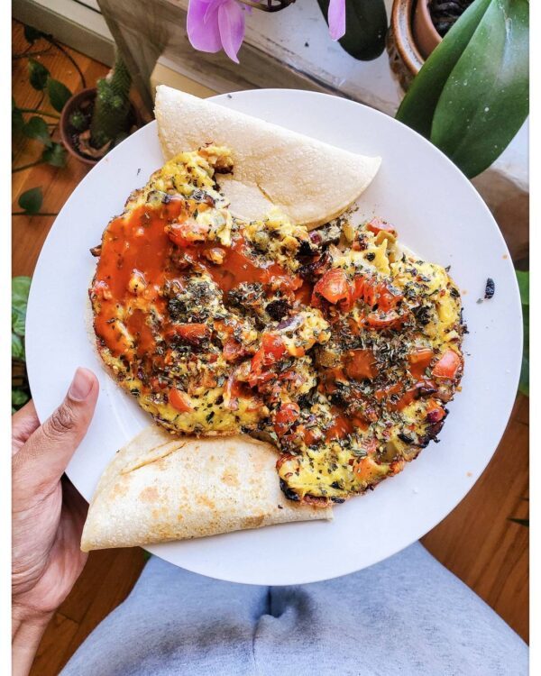 Plate of vegan scrambled tofu with tortillas